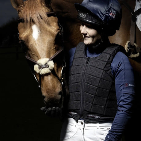 Black quilted horse riding vest with zipper front and ’race safe’ branding