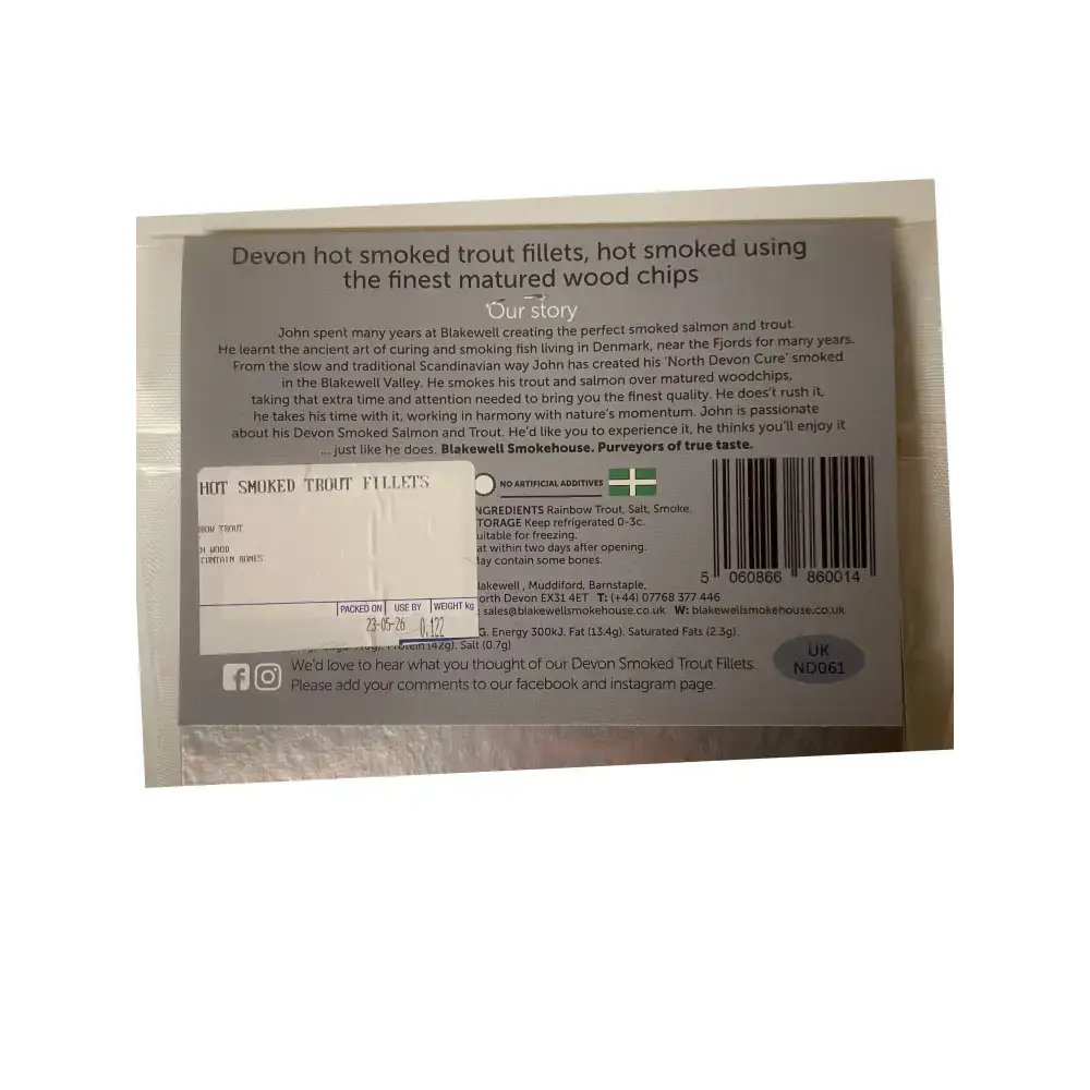 The back of blakewell smokehouse devon hot smoked trout fillets package wrapped in white and silver foil with black text