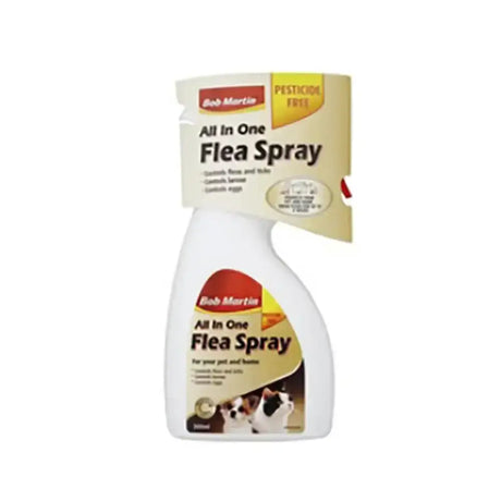 White plastic spray bottle of bob martin clear flea and tick spray with beige and red label featuring cats