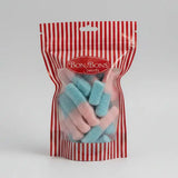 A red and white striped bag of bon bon sweets pouches filled with blue and pink two-toned gummy candies with sugar coatings