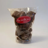 A clear plastic bag of dark chocolate-covered candied fruit with sugar coatings branded as bon bon sweets pouches