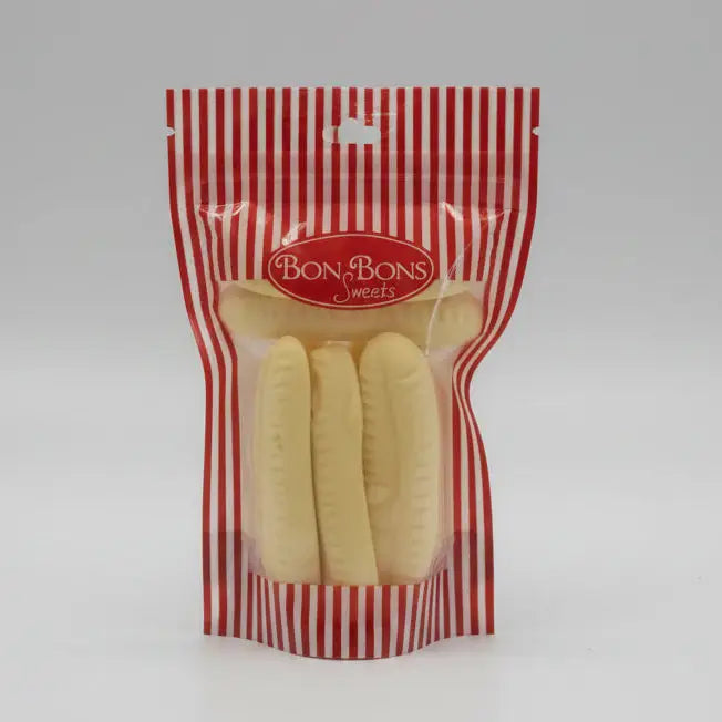A red and white striped package of bon bon sweets pouches with pale yellow banana-shaped bon sweets with sugar coatings