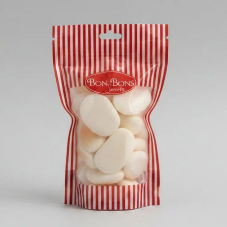 A red and white striped plastic bag filled with off-white oval candies from bon bon sweets pouches with sugar coatings