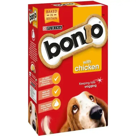 Red and yellow box of purina bonio chicken dog biscuits shaped like bones in biscuit chicken flavour dog treats