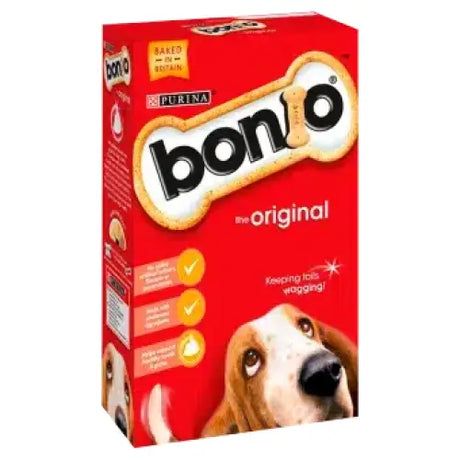 Red cardboard box of bonio dog biscuit the original 650g with bone-shaped chicken dog biscuits and purina branding