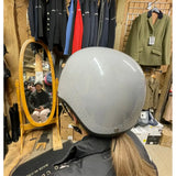 Gray equestrian helmet with speckled finish and black trim perfect for booking a fitting appointment with horses