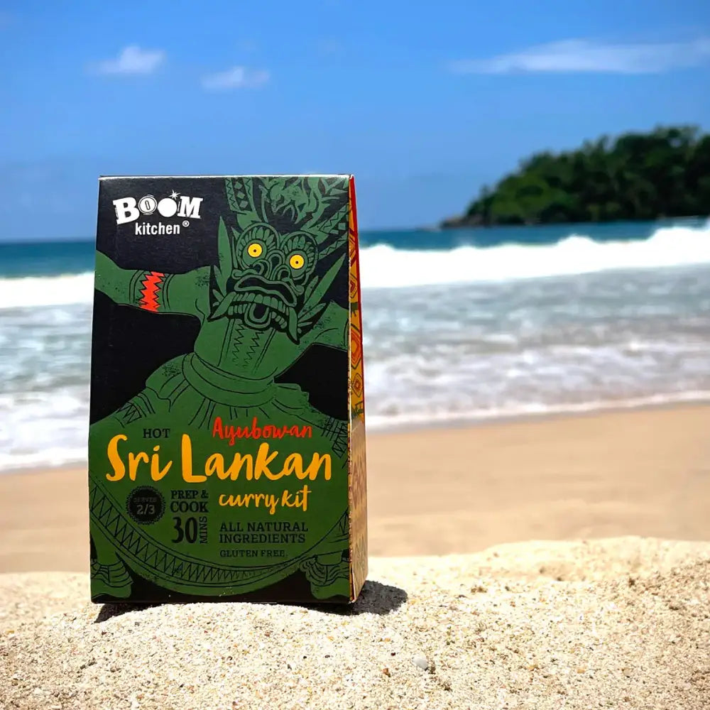 Green and black cardboard box of boom kitchen ayubowan sri lankan premium recipe kit with a stylized demon image