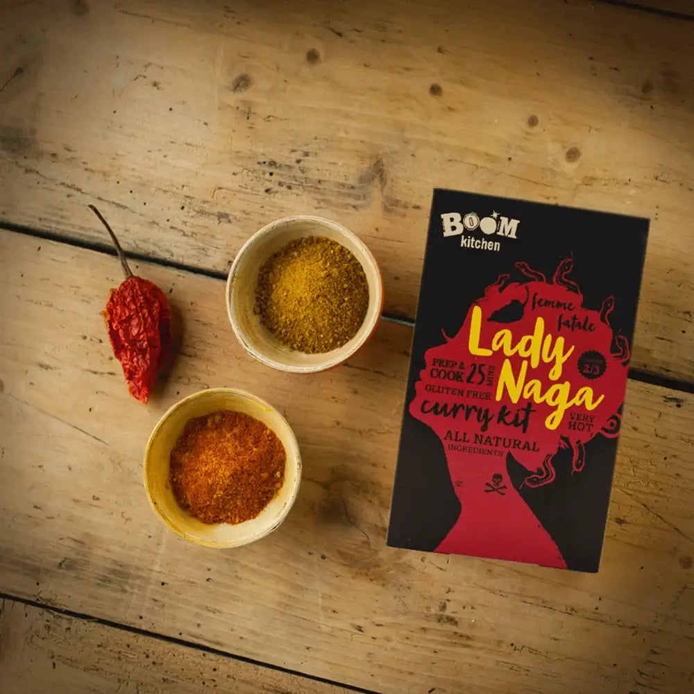 Black and red boom kitchen lady naga vindaloo curry kit box with stylized silhouette design for easy cooking