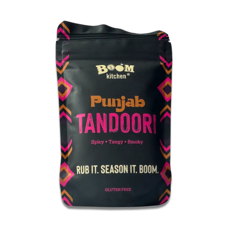 Black boom kitchen punjab tandoori meat rub pouch with vibrant pink and orange geometric patterns on the sides