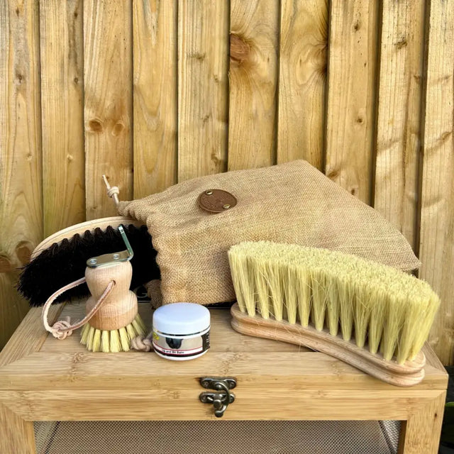 A borstiq care essentials brush with natural fiber pale yellow bristles and a light wood handle from essentials set comprises