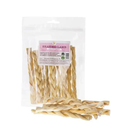 Beige braided lamb chews in clear plastic package with pink and white labeling easily digestible braided lamb treats