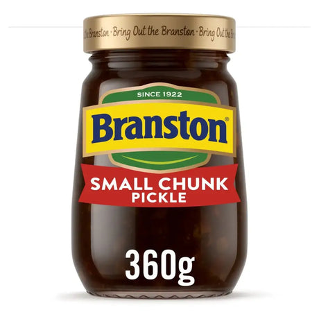 A glass jar of branstone pickle small chunk with a gold lid and colorful blue yellow green red label