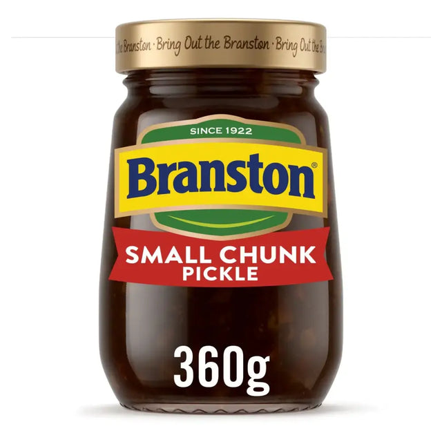 A glass jar of branstone pickle small chunk with a gold lid and colorful blue yellow green red label
