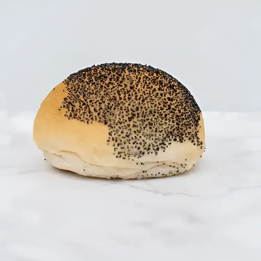 A golden brown poppy seed bread roll with a soft glossy crust in bread rolls packs of 2