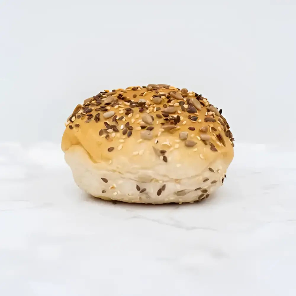 Golden brown seeded bread rolls packs of 2 with soft glossy crust topped with sesame sunflower and dark seeds