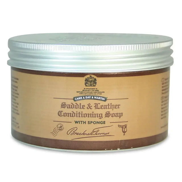 Brown jar of brecknell turner saddle soap with silver lid and attached sponge for traditional soft wax leather care