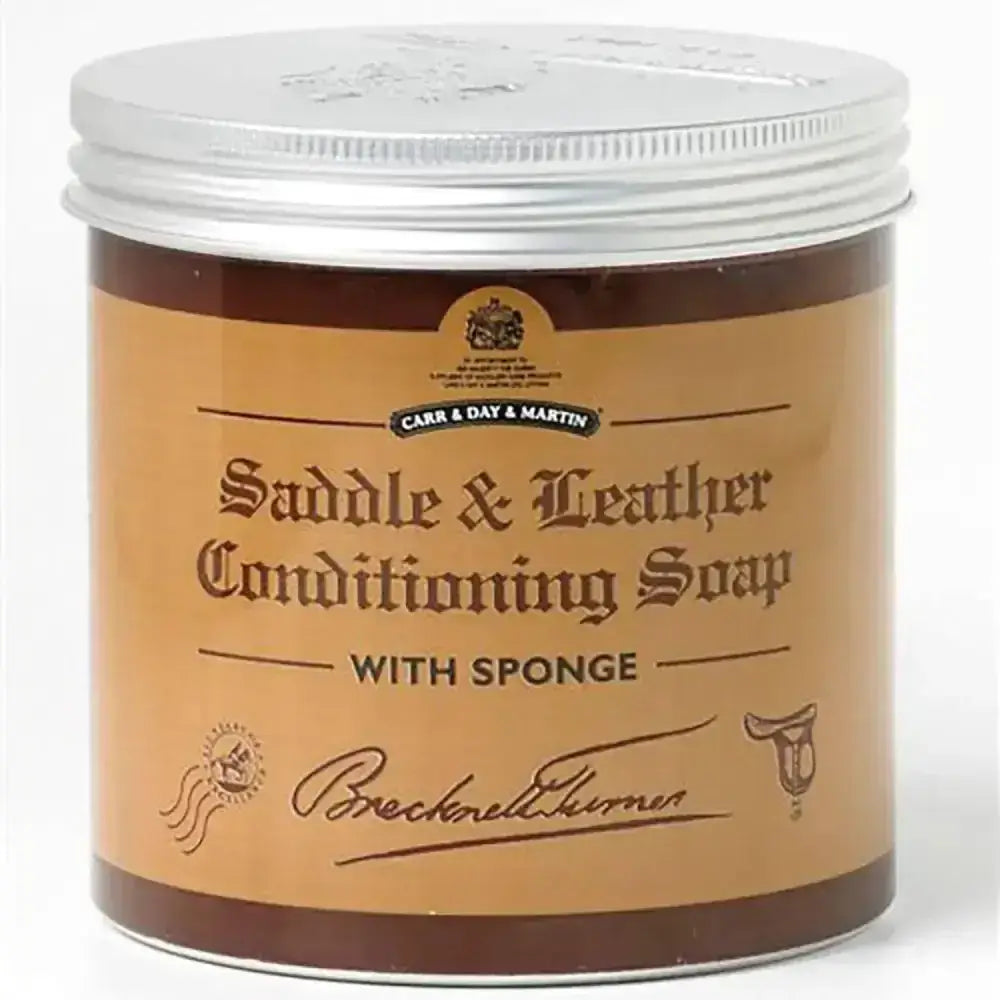Brown jar of brecknell turner saddle soap with tan label and silver lid featuring traditional soft wax and sponge included