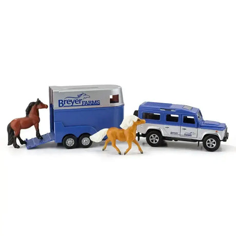 Blue and silver breyer farm land rover with tag-a-long wagon horse trailer featuring detailed windows and wheels