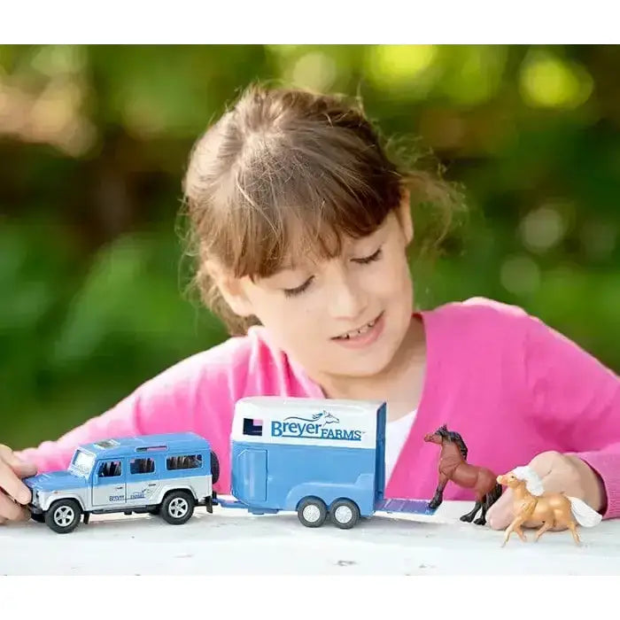 Blue breyer farm tag-a-long wagon horse trailer with white logo and black wheels for land rover playsets