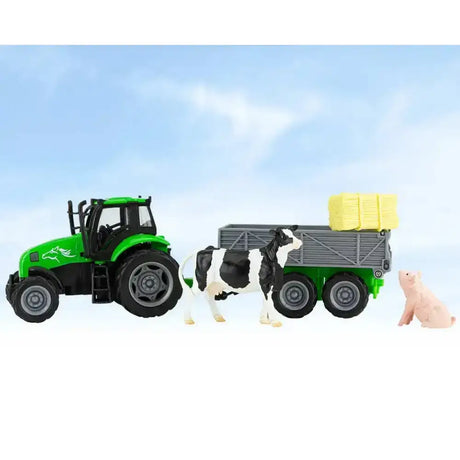 Green plastic breyer farm tractor with black wheels and gray tag-a-long wagon carrying yellow hay bales