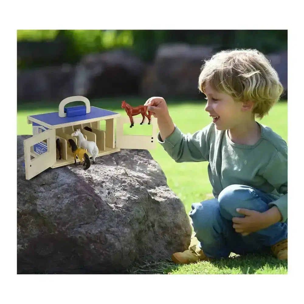 Breyer farms wooden carry case with blue roof and white handle featuring wooden toy stable and miniature horses inside
