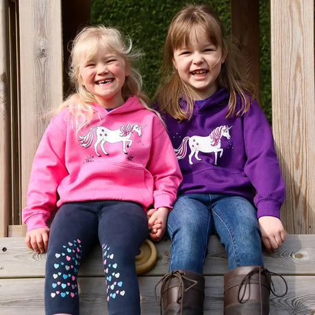 Two girls in matching sweatshirts from British Country Collection Dancing Unicorn