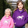 Two smiling children in hooded sweatshirts from British Country Collection Dancing Unicorn