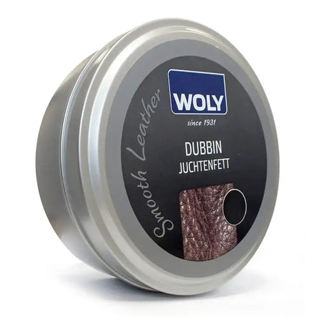 Woly brogini leather dubbin black in a sleek silver tin with black label and brown textured leather sample