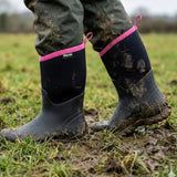 Black brogini wb145 keswick ladies muck boots with pink trim covered in mud perfect for outdoor use