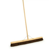 Brown bristle bassine broom head fitted with a light wood handle bassine broom for easy sweeping tasks