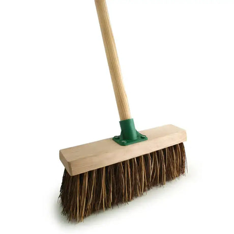A bassine broom fitted with a sturdy wooden handle green metal ferrule and natural brown bristles with 4’6 handle