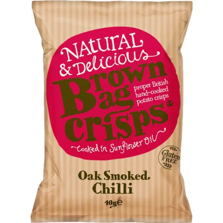 A beige striped paper bag of brown bag crisps oak smoked chilli flavor with a pink circular label on the front
