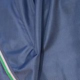 Blue woven fabric of bucas smartex rain sheet pony with green white striped trim made from thermobonded polyester wadding