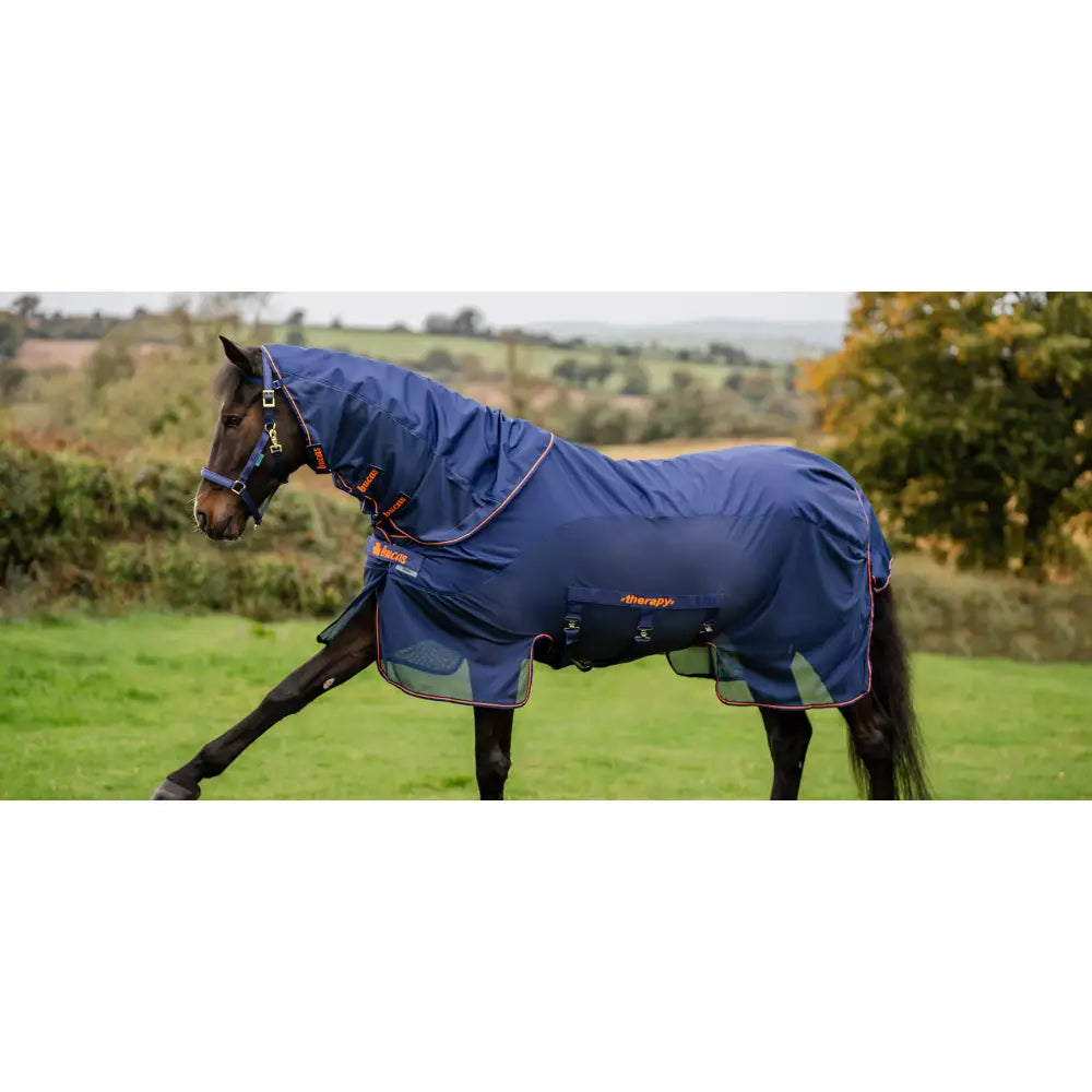 Navy blue bucas therapy mesh cooler horse blanket with orange trim and brand logo for cooling and comfort