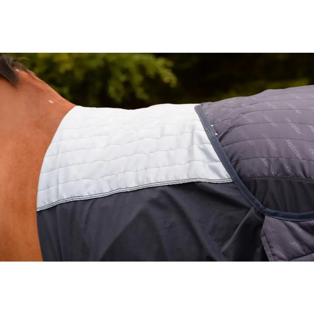A bucas therapy mesh cooler horse blanket with dark gray quilted fabric and a white stitched panel with subtle branding