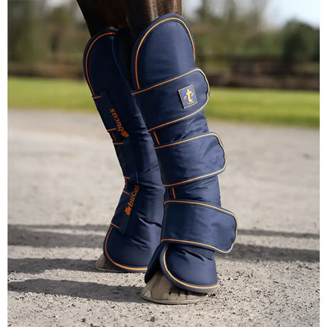 Navy blue bucas therapy travel boots with orange stitching ripstop outer and padded leg wrap design