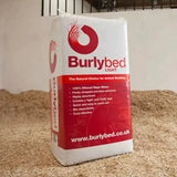 A white and red bag of burlybed lite rape straw horse bedding with a bold logo and stylized straw design