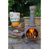 Rustic chiminea with burning Burlyburn Solid Fuel for cozy outdoor warmth