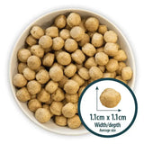 Light brown round kibble pellets in a white bowl for burns hypoallergenic mixer dog food for sensitive dogs