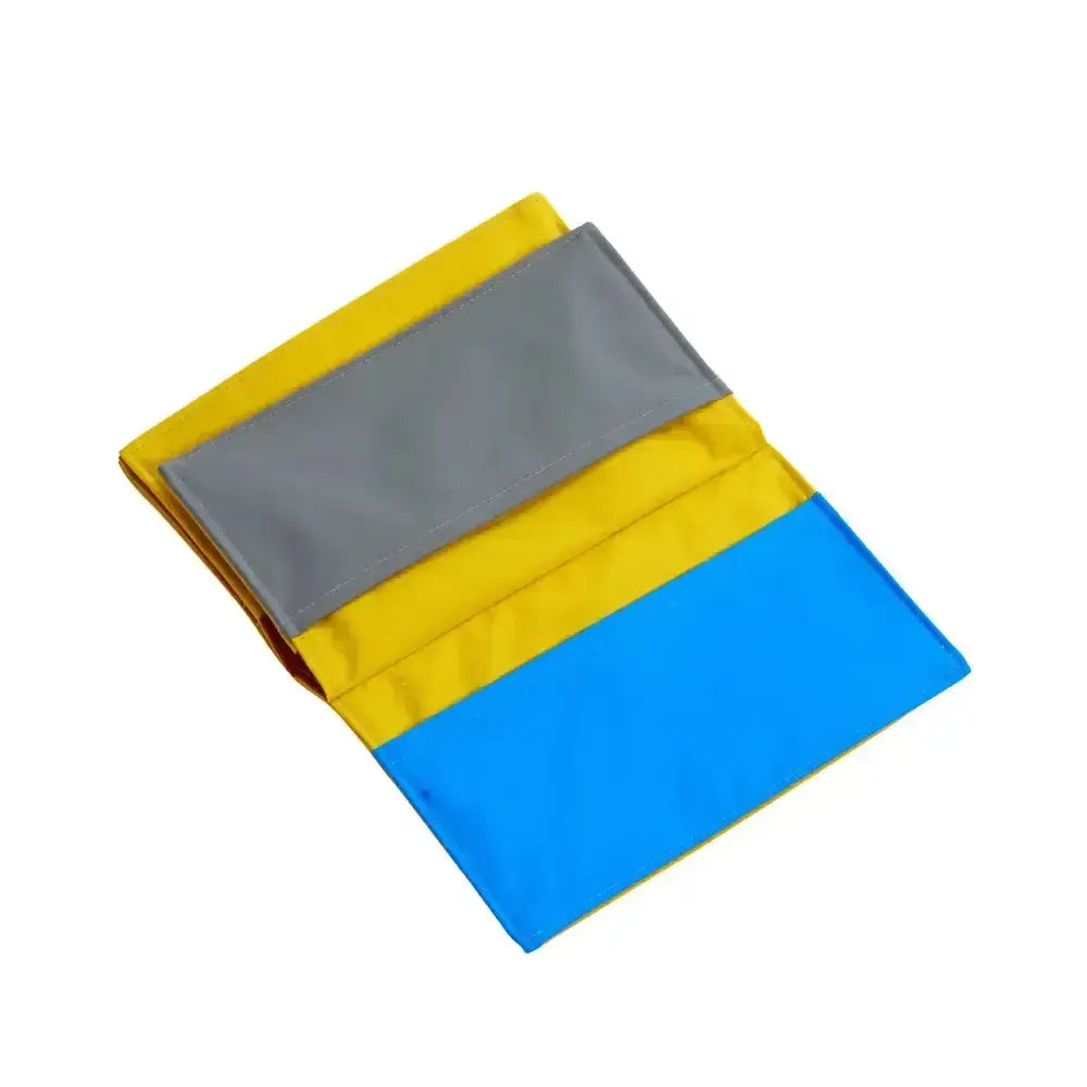 Folded three-panel cooling towel with yellow gray and blue sections for buster activity mat game use