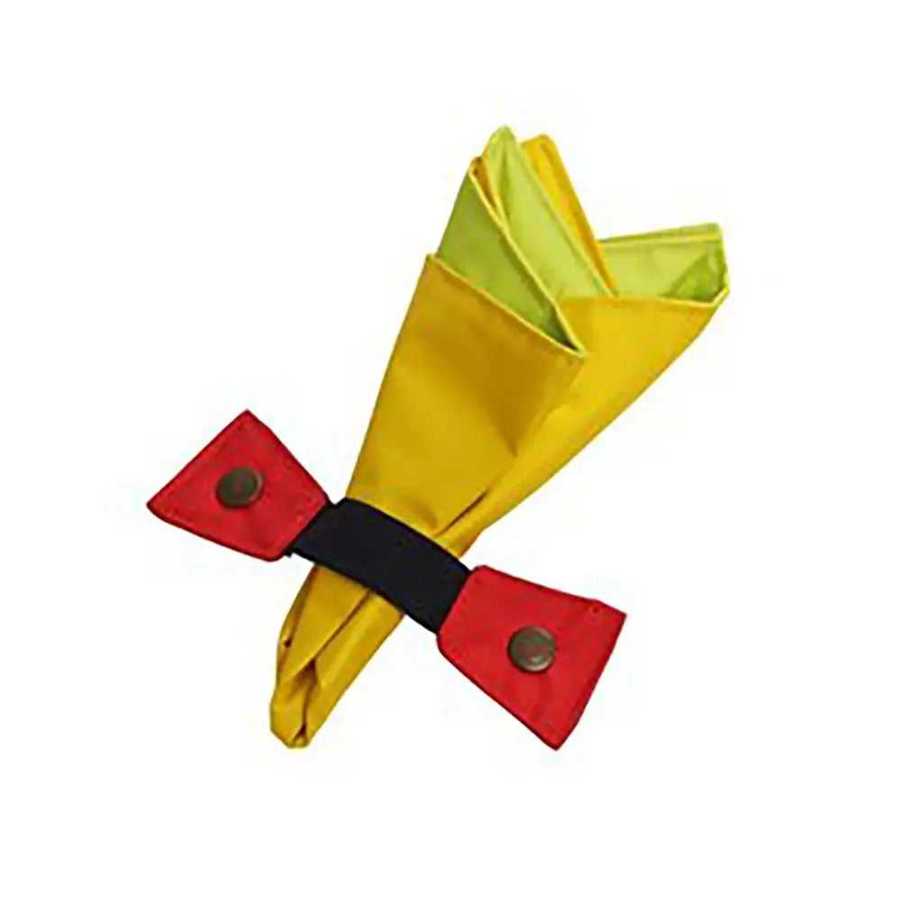 A vibrant yellow buster activity mat napkin folded with a red bow tie and black straps on the activity mat game cloth