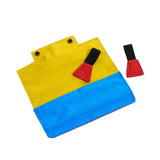 Bright yellow and blue two-tone fabric pouch with red and black straps for buster activity mat game rockn roll