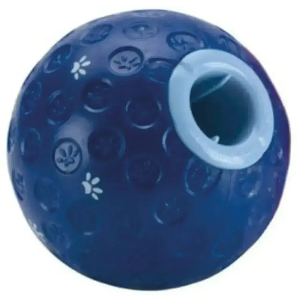Blue rubber buster treat ball dog toy with white paw and flower patterns and a central hole for treats