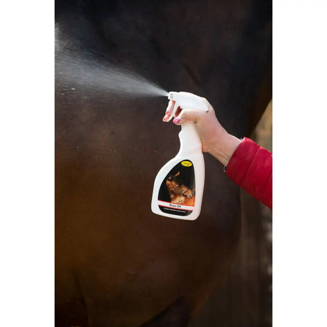White plastic citronella spray bottle labeled bute oil with horse image for smart grooming buzz against airborne pests