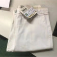 White denim caldene white harrison ladies breeches with visible side logo and attached price tag
