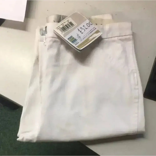 White denim caldene white harrison ladies breeches with visible side logo and attached price tag