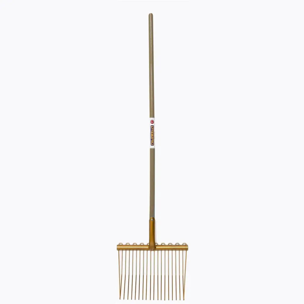 Gold-colored metal caldwells bedding fork long handle with evenly spaced tines ideal for cattle sheds use