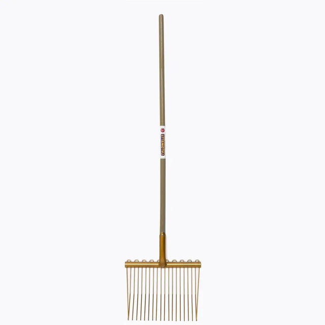 Gold-colored metal caldwells bedding fork long handle with evenly spaced tines ideal for cattle sheds use