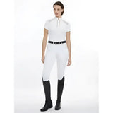 White camille short sleeve show shirt with high collar paired with black boots and belt for equestrian use