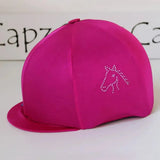 A vibrant fuchsia lycra horse head diamondz cap cover by capz diamondz with sparkling rhinestone design for helmets